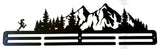 Metal wall art with a mountain and running figure design on a white background