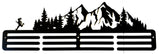 Metal wall art with mountain and forest design on a white background