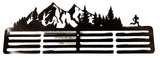 Decorative metal grill with mountain and nature design on a textured background