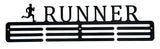 A black steel medal hanger in the shape of a silhouette of a runner with the word 'RUNNER' above it and three horizontal rows for hanging medals.